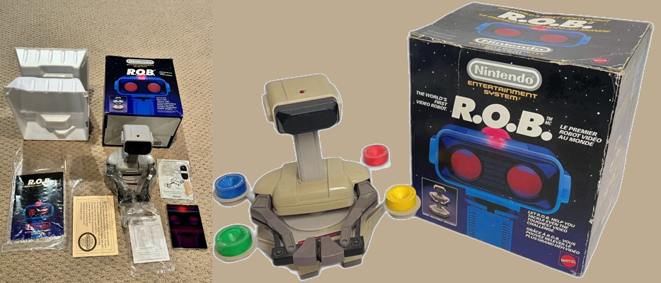 Die Verpackung, der Roboter und die Zubehörteile des Nintendo-Roboters R.O.B. auf einem Tisch. Die Verpackung ist teilweise geöffnet und zeigt den Roboter R.O.B.